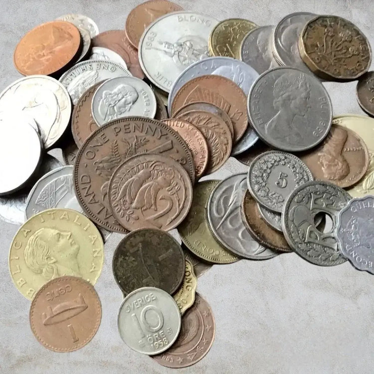 An exquisite collection of coins piled gracefully on a sophisticated table, radiating an aura of affluence and grandeur.