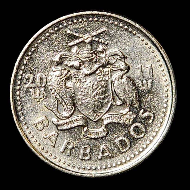 A coin displaying a windmill, a symbol of clean energy and environmental consciousness.