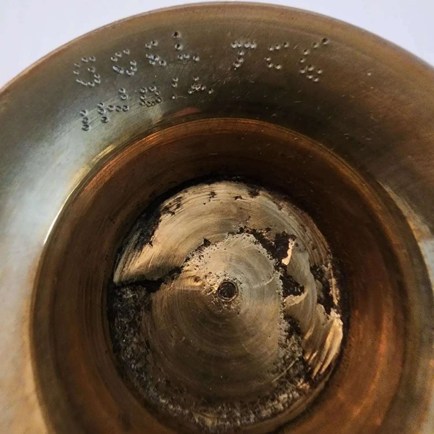 A beautifully crafted brass bowl adorned with intricate designs, showcasing elegance and artistry in every detail.