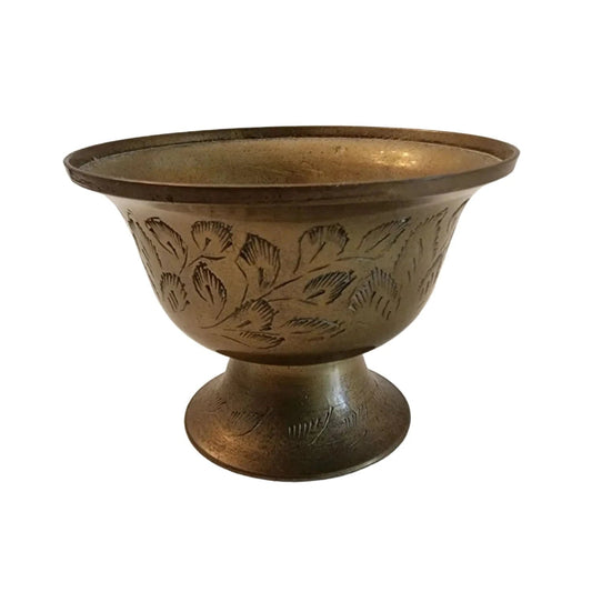 A beautifully crafted brass bowl adorned with intricate designs, showcasing elegance and artistry in every detail.