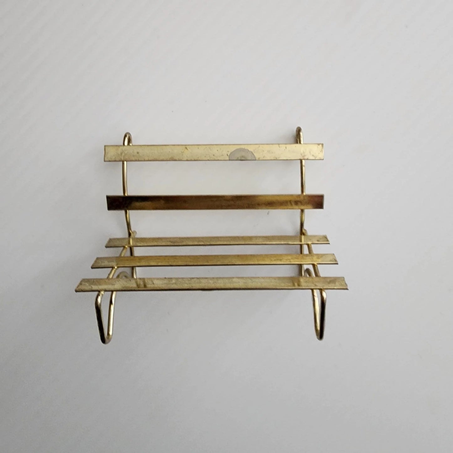 A vintage bridal couple sitting on a bench, radiating love and happiness on their special day.