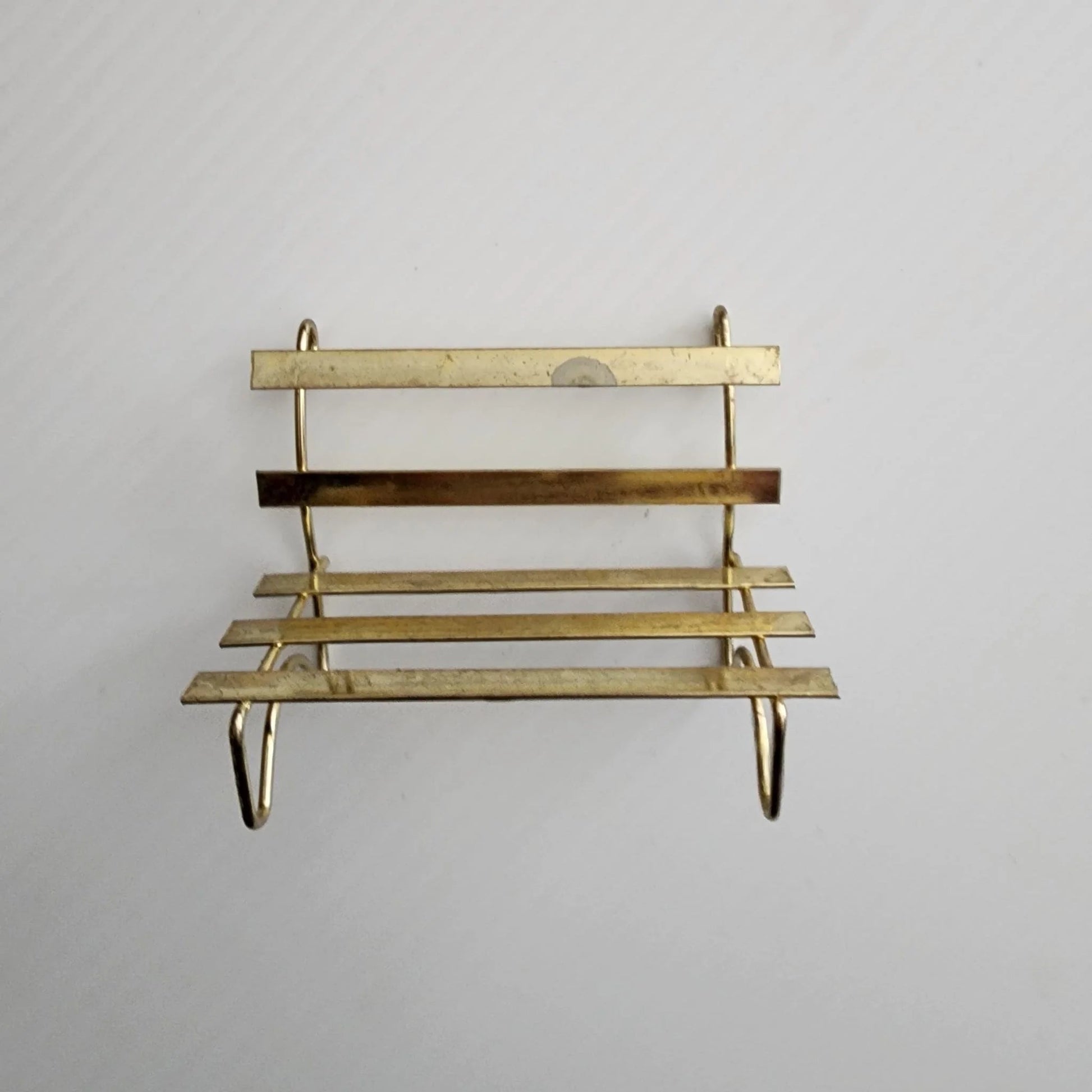 A vintage bridal couple sitting on a bench, radiating love and happiness on their special day.