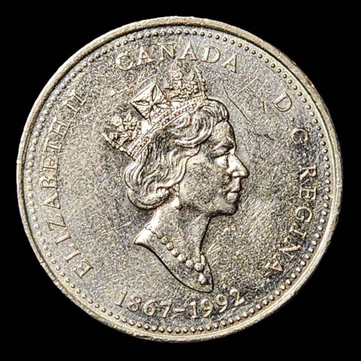 A coin featuring a lighthouse, symbolizing guidance and illumination.