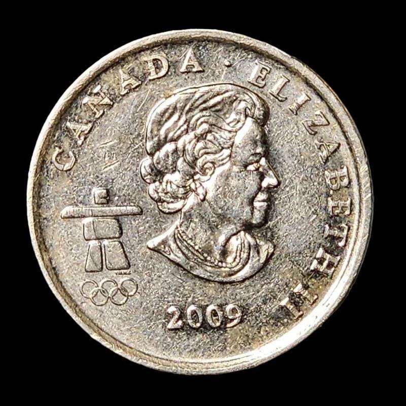 A coin featuring a man gracefully skating on its surface, showcasing elegance and movement.