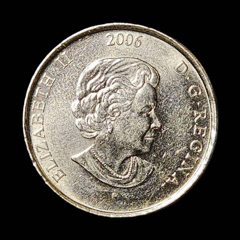 Canadian coin with pink ribbon, symbolizing support for breast cancer awareness.