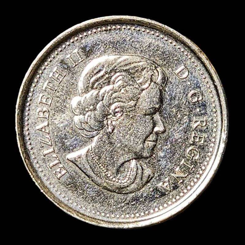 A Canadian coin featuring a whale and fish.