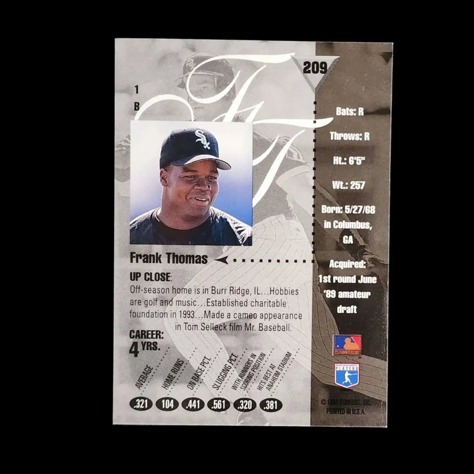 Collectible baseball card showing Frank Thomas in a white sox uniform.