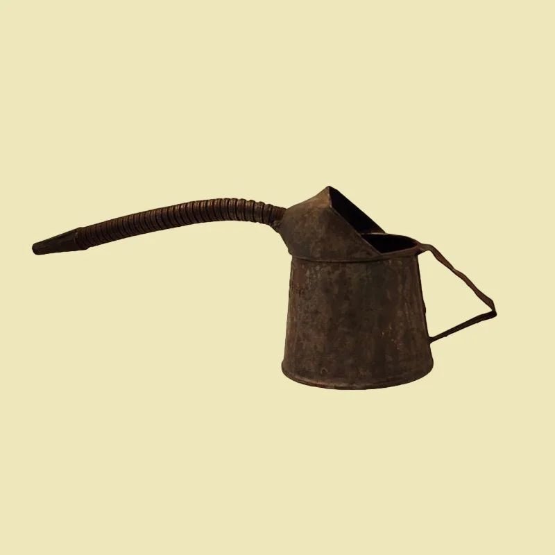 An antique jug with a lengthy nose, perfect for tending to automotive needs
