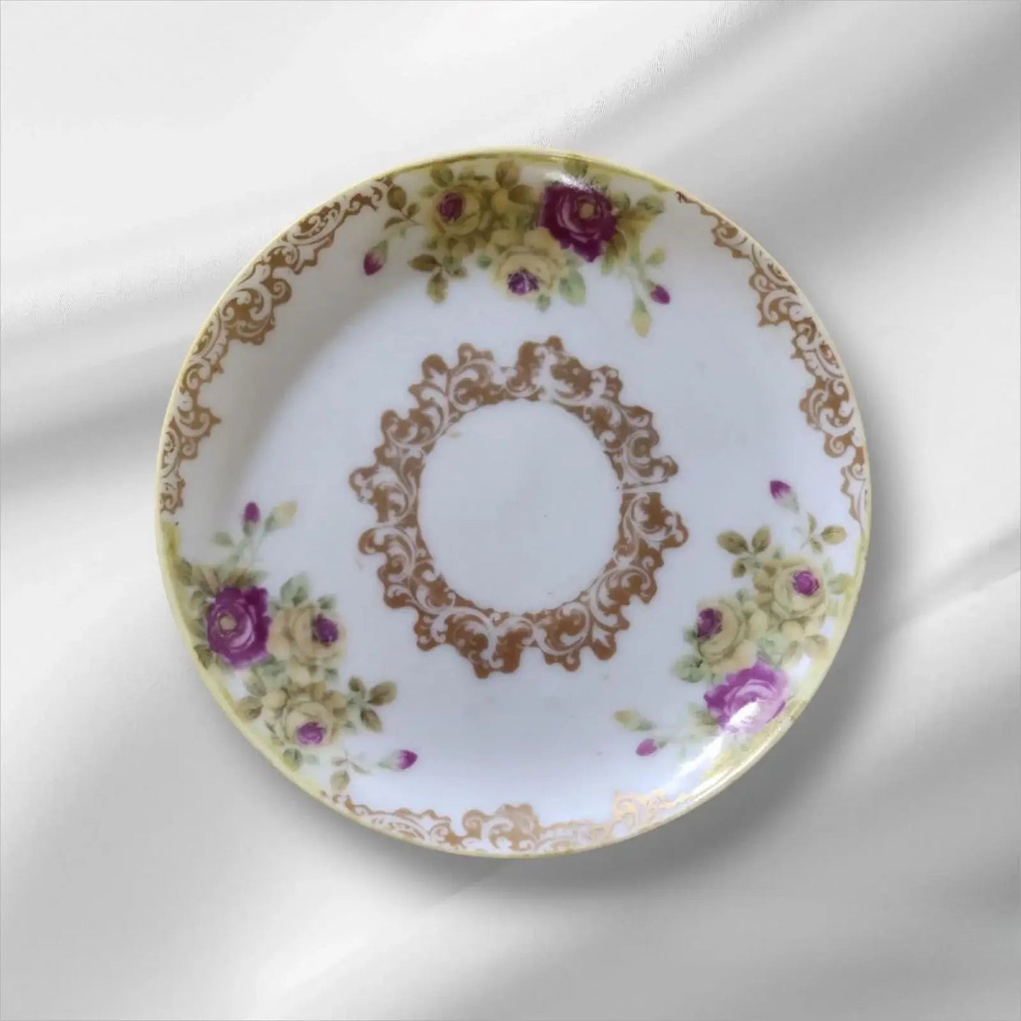 Cup and saucer on two books, creating a cozy reading nook.