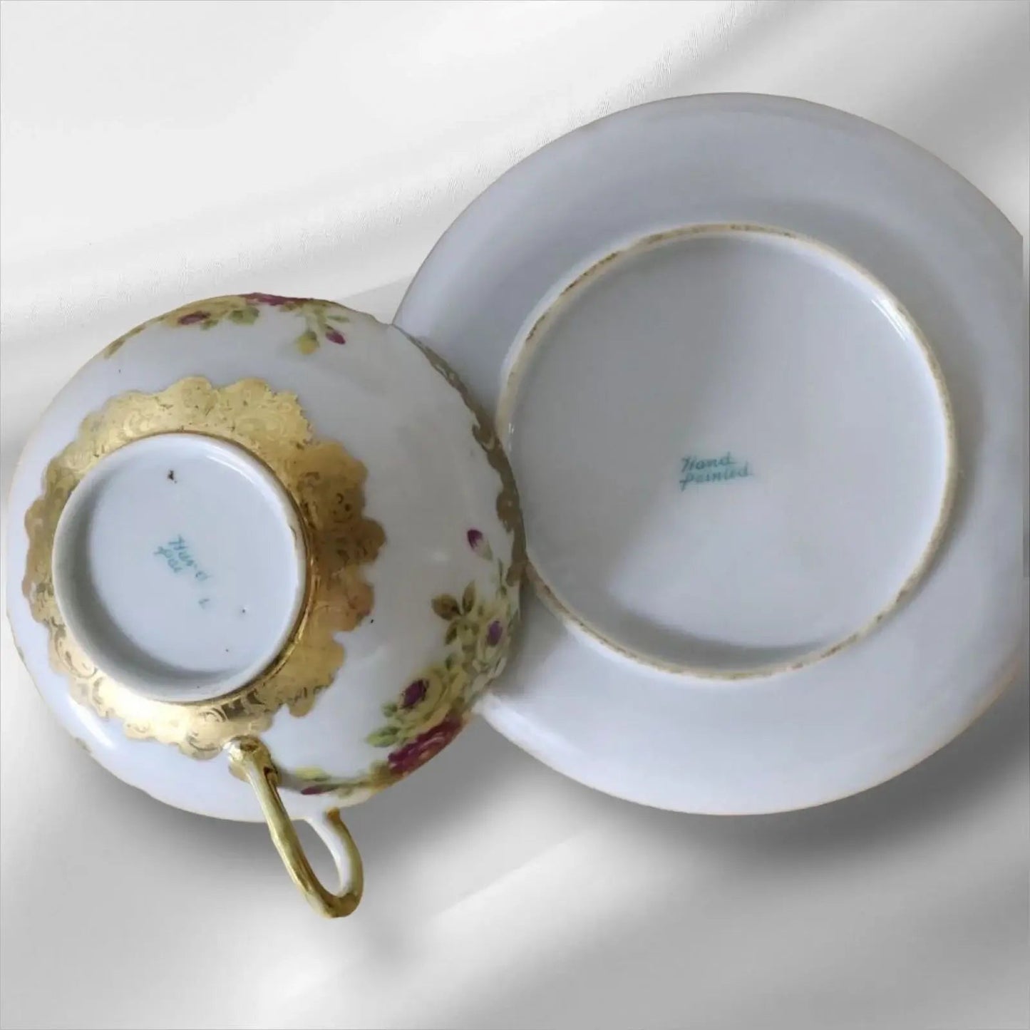 Cup and saucer on two books, creating a cozy reading nook.