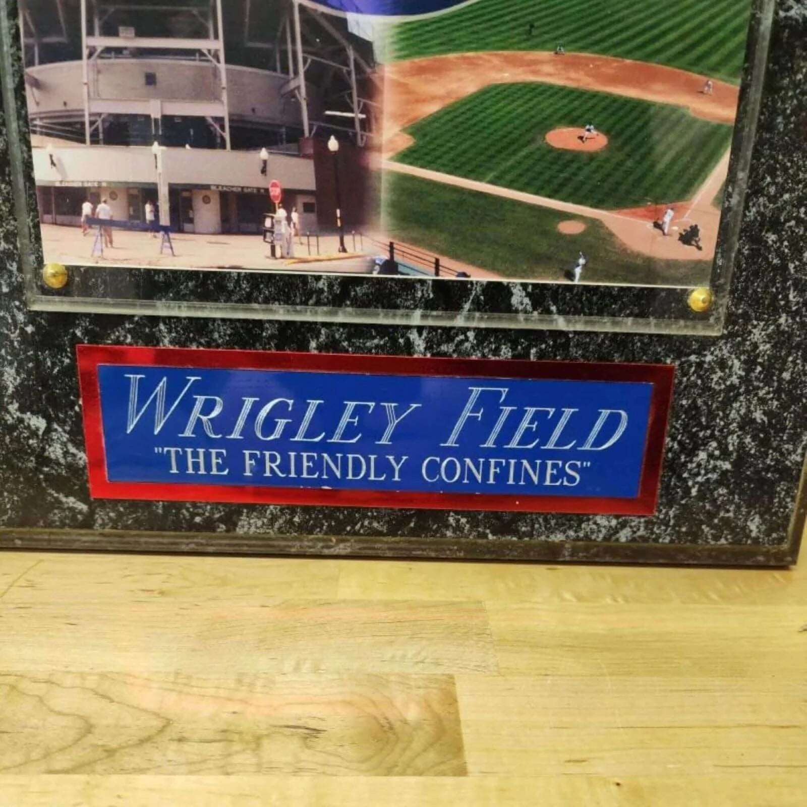 Commemorative plaque at Wrigley Field honoring the Chicago Cubs, a historic baseball team.