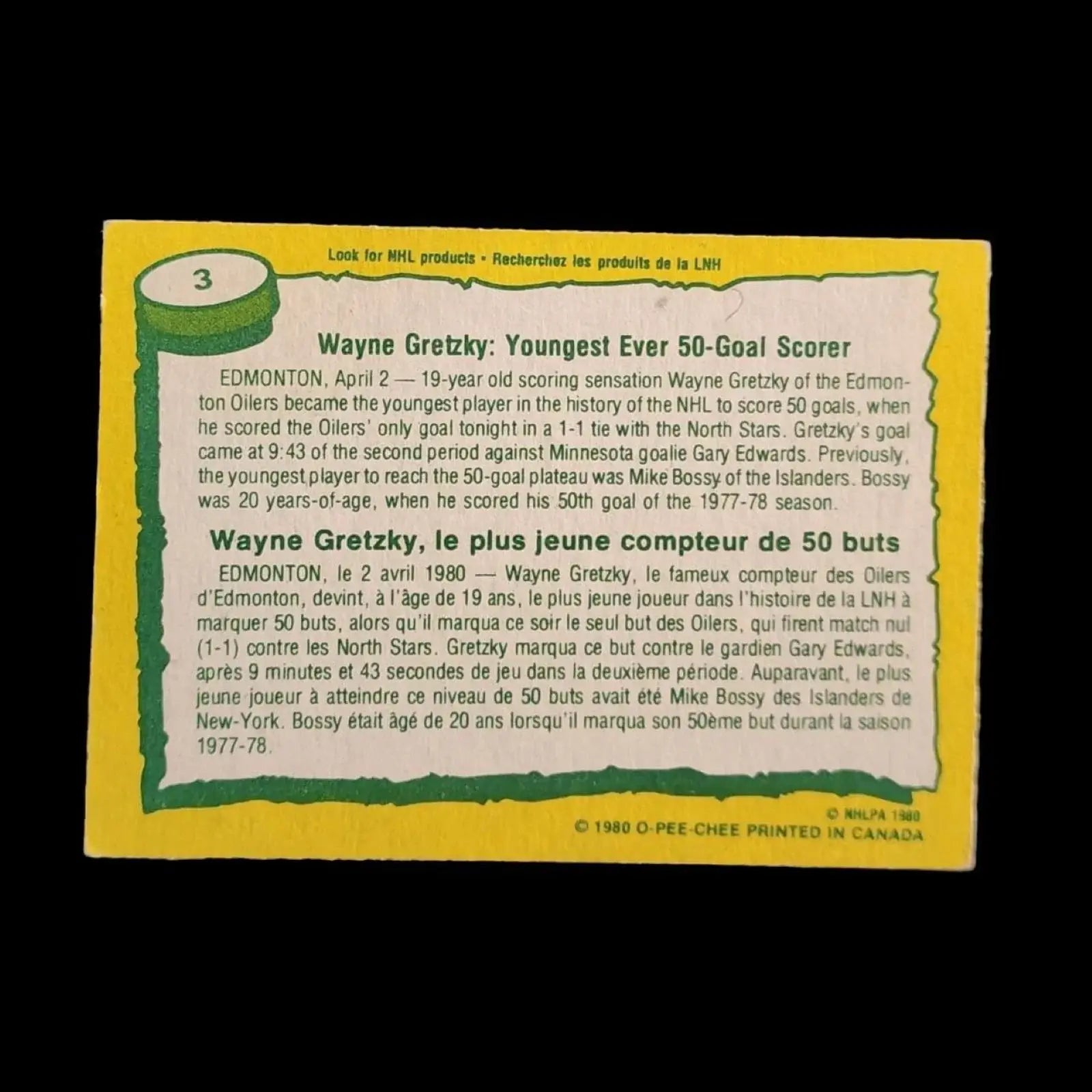 A hockey card featuring Wayne Gretzky with the words "record breaker" on it