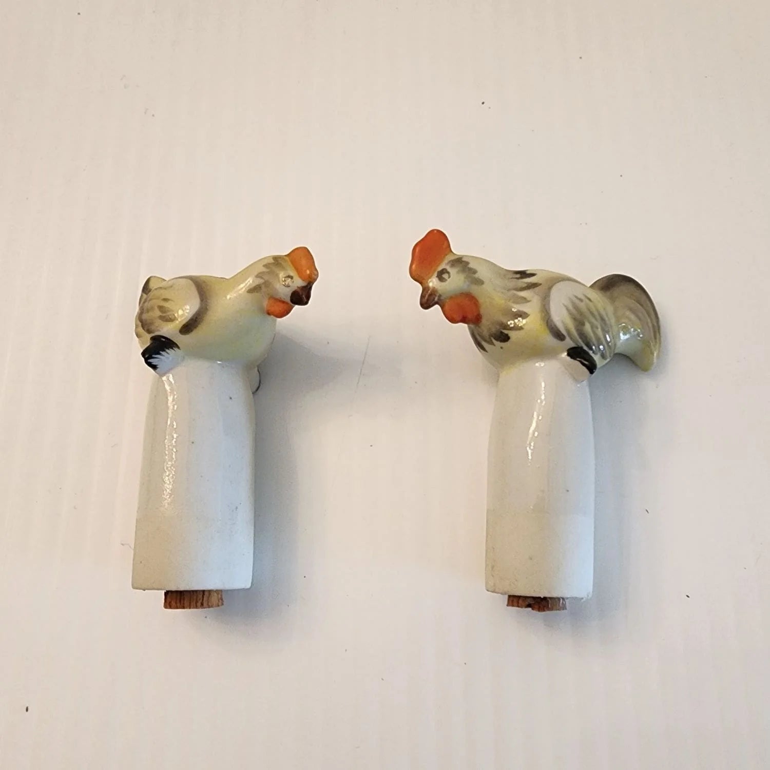 Ceramic box with two bobble birds on the top