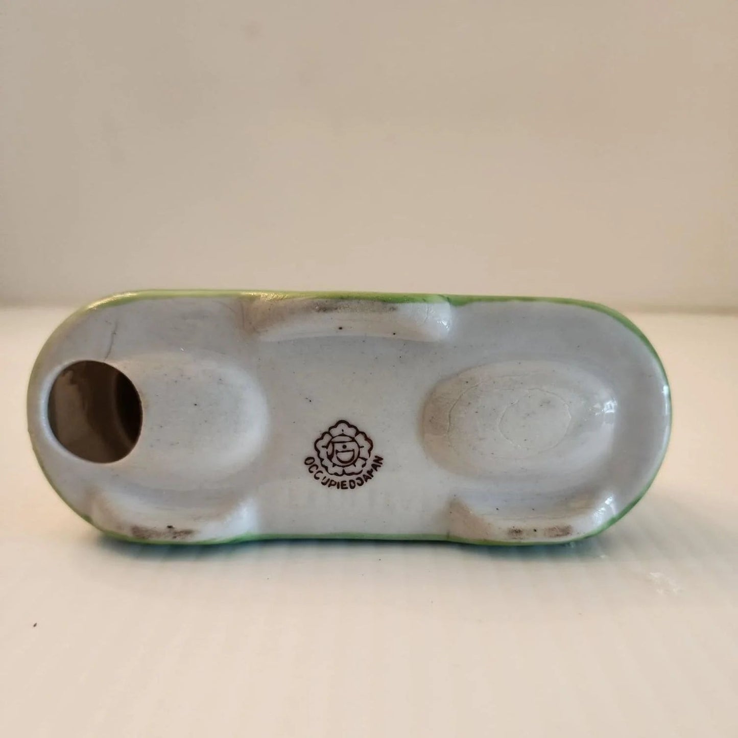 Ceramic box with two bobble birds on the top