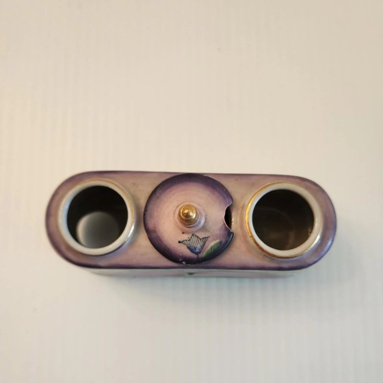 Ceramic box with two bobble birds on the top