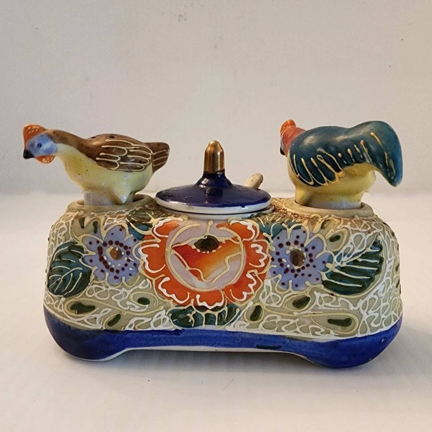 Delicate ceramic tray adorned with two bird designs.