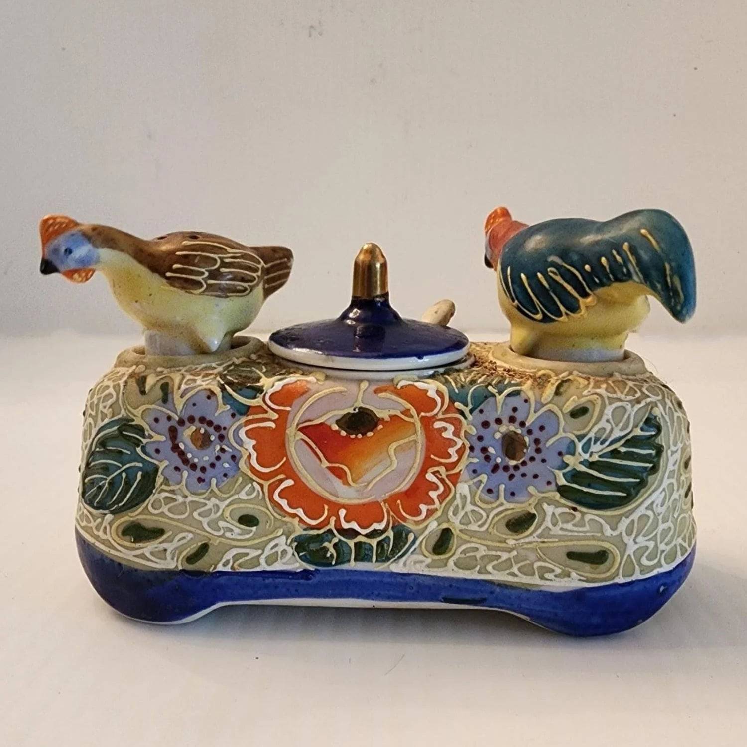 Delicate ceramic tray adorned with two bird designs.