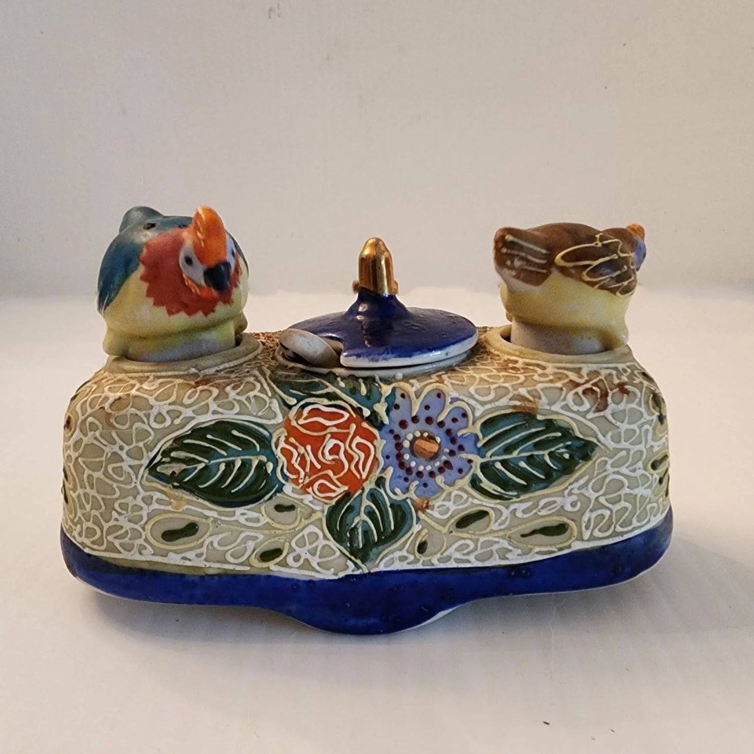 Delicate ceramic tray adorned with two bird designs.