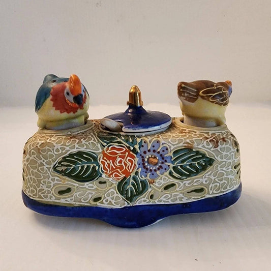 Delicate ceramic tray adorned with two bird designs.