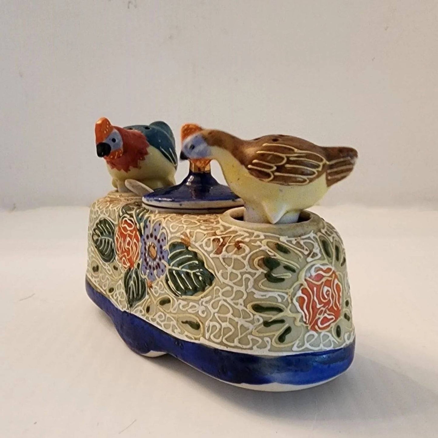 Delicate ceramic tray adorned with two bird designs.