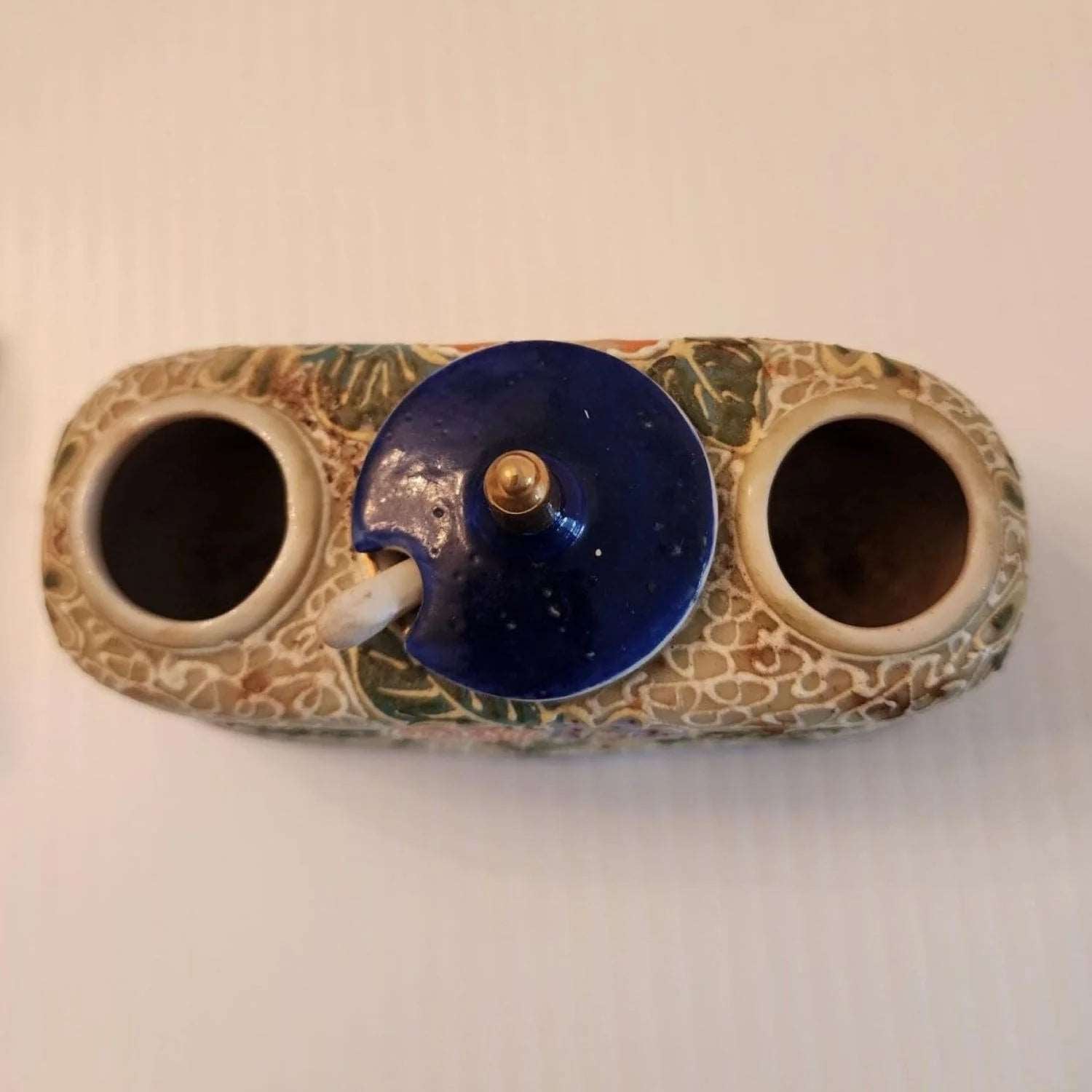 Delicate ceramic tray adorned with two bird designs.