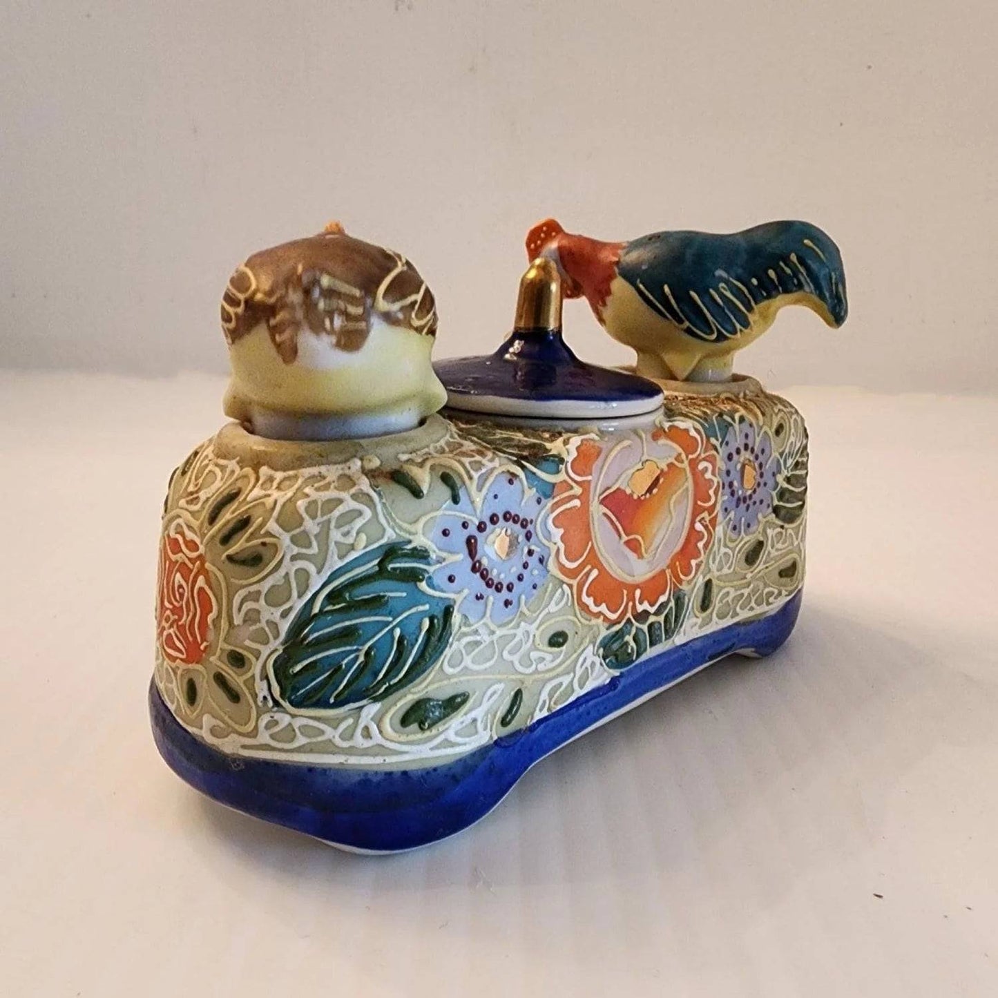 Delicate ceramic tray adorned with two bird designs.