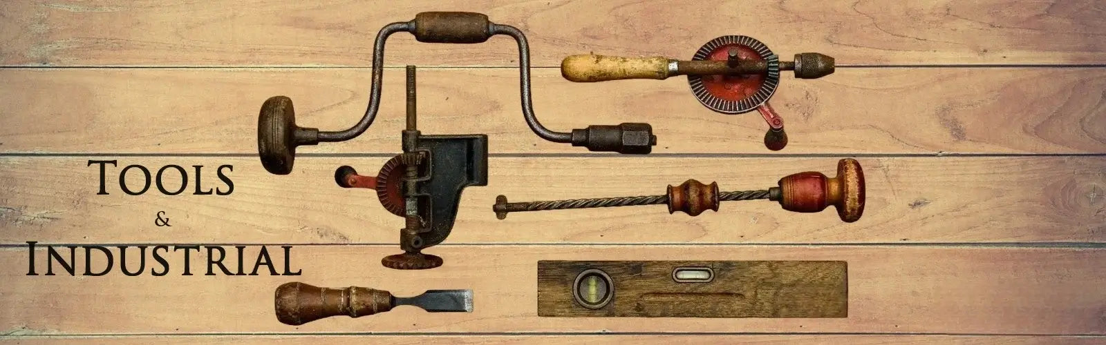 Antique or vintage tools laying on a wood counter