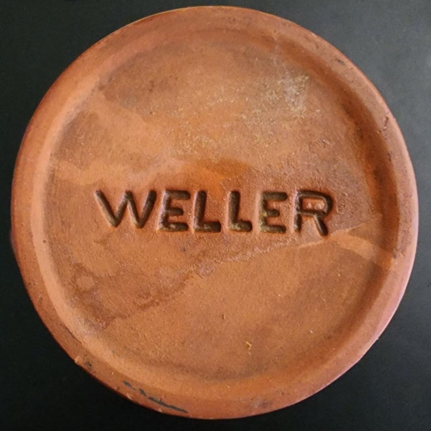 A brown jug with a handle on a white background.