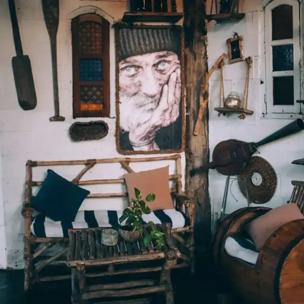 A serene room featuring a wooden chair, an elegant painting, and a refined table, exuding timeless sophistication.