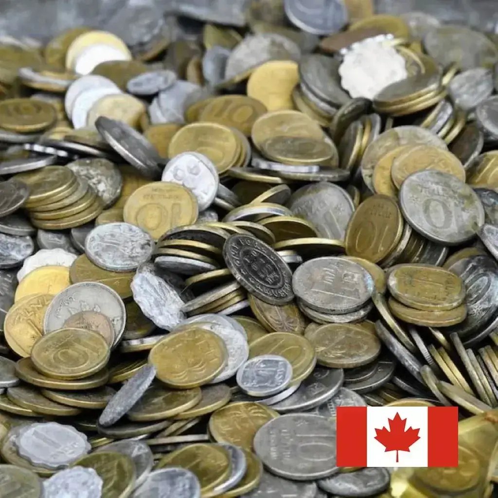 A collection of various denominations of Canadian currency, including pennies, nickels, dimes, quarters, and loonies.