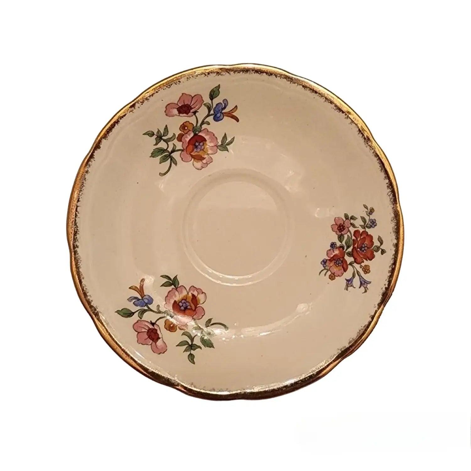 A beautifully designed tea cup and saucer adorned with vibrant floral patterns, resting gracefully on a table.