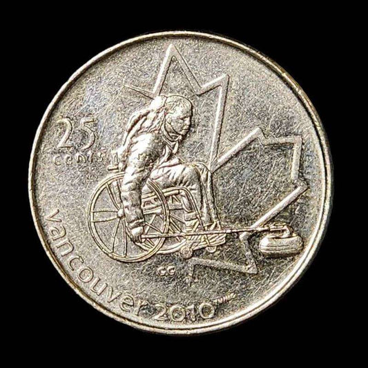 A coin featuring a man in a wheelchair seated on it, symbolizing inclusivity and representation.