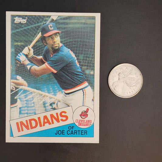 A baseball card featuring a coin beside it, showcasing a valuable collectible item.