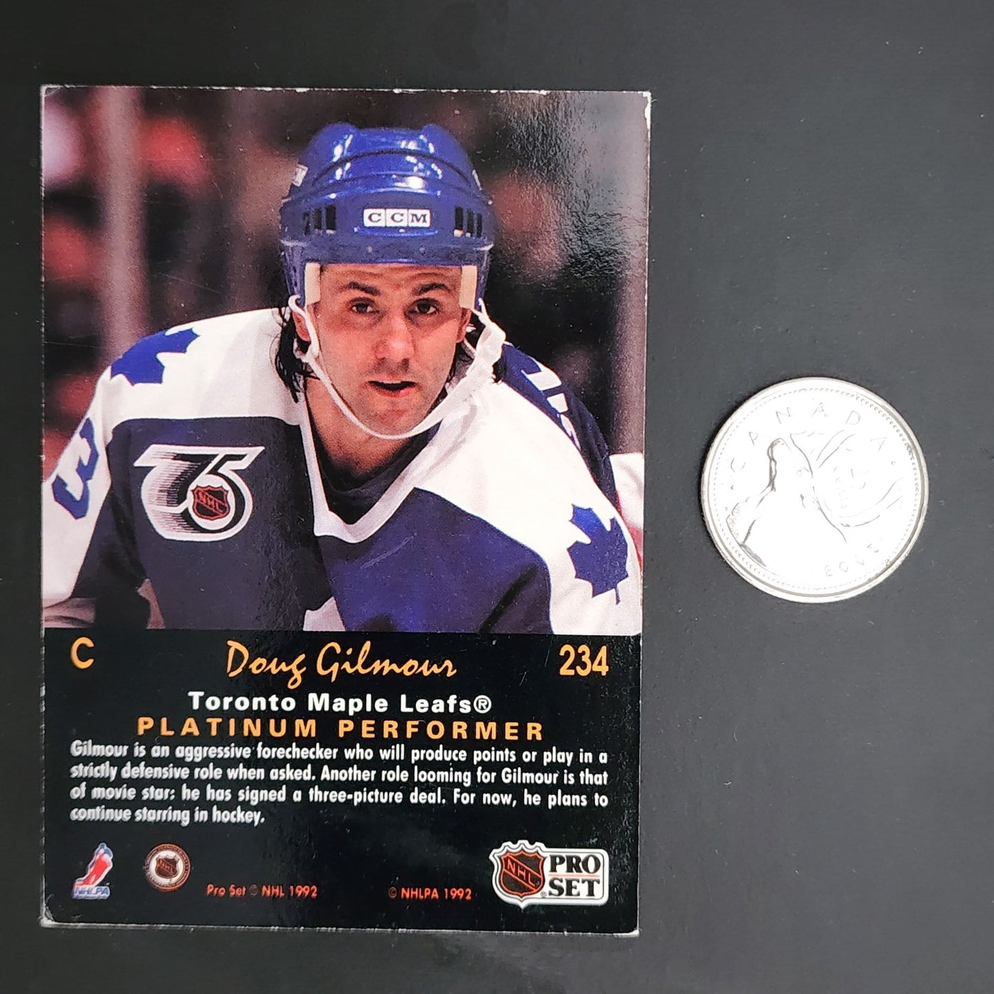 Doug Gilmour hockey card - A trading card featuring Doug Gilmour, a professional hockey player.