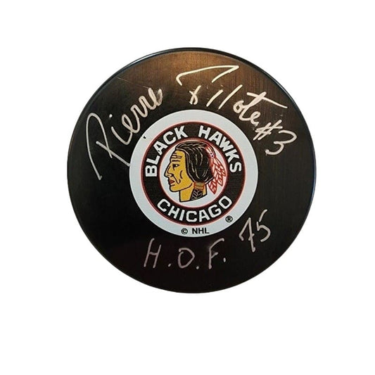 Autographed hockey puck by Pierre Pilote