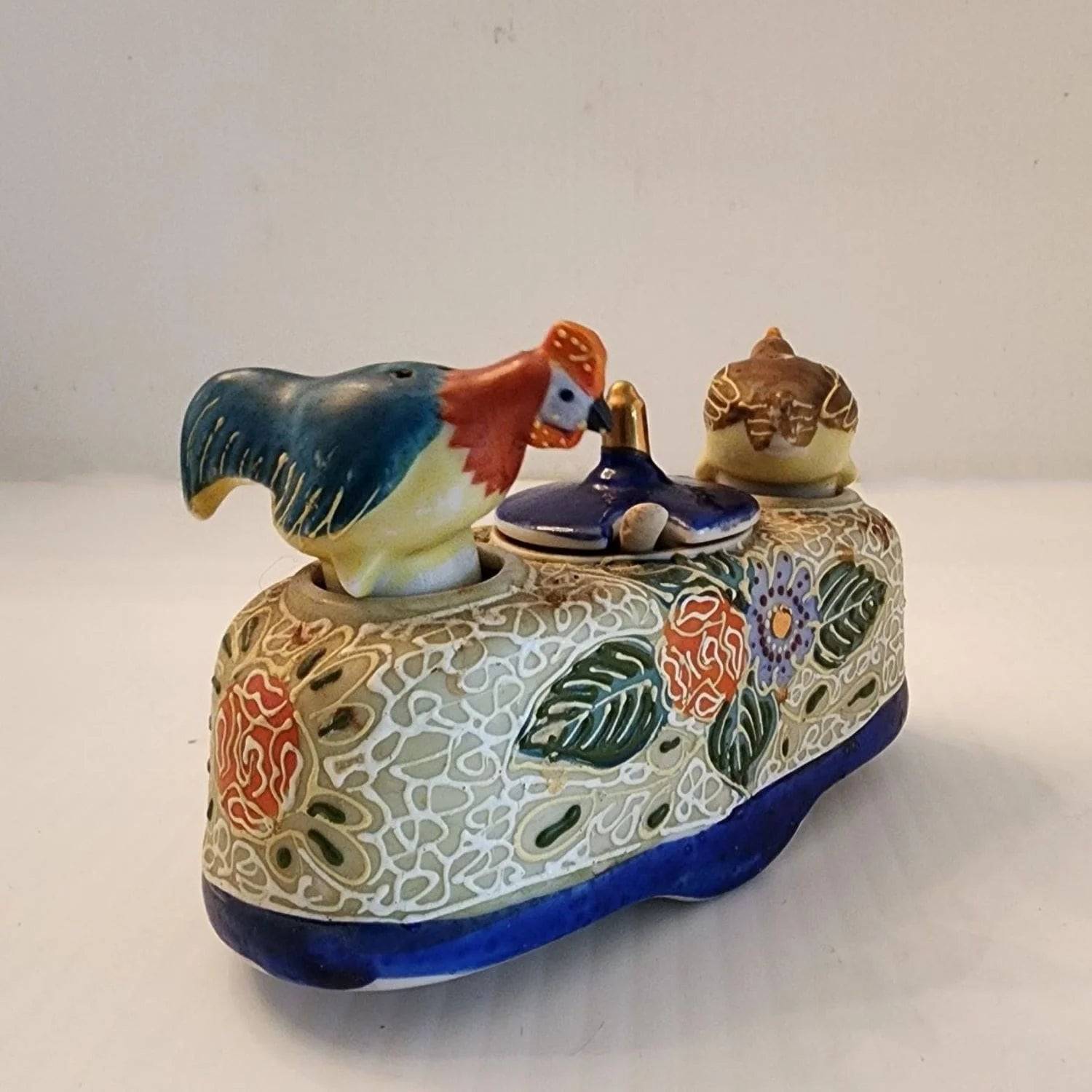 Delicate ceramic tray adorned with two bird designs.